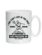 A white ceramic mug featuring the slogan on the front 'You Can’t Live in the Past, You’ve Got To Keep Looking Forward and Pressing On – Pete Sampras'