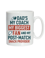 White mug with colorful text about a father's role in sports on a white background, with a slogan on the front saying 'Dad’s My Coach My Biggest Fan and My Post-Match Snack Provider!