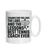 A white mug with the funny tennis coach saying on the front that reads 'Thanks for the Love the Lobs and the Lessons. Best Tennis Coach Ever'