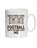 A ceramic white mug with the funny football saying on the front saying 'Dad’s First Love: Football. Dad’s Second Love: Me'
