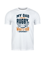 White t-shirt with rugby-themed text and graphic on a white background, with a slogan on the front saying 'My Mum Tackles Everything on the Pitch and at Home!'