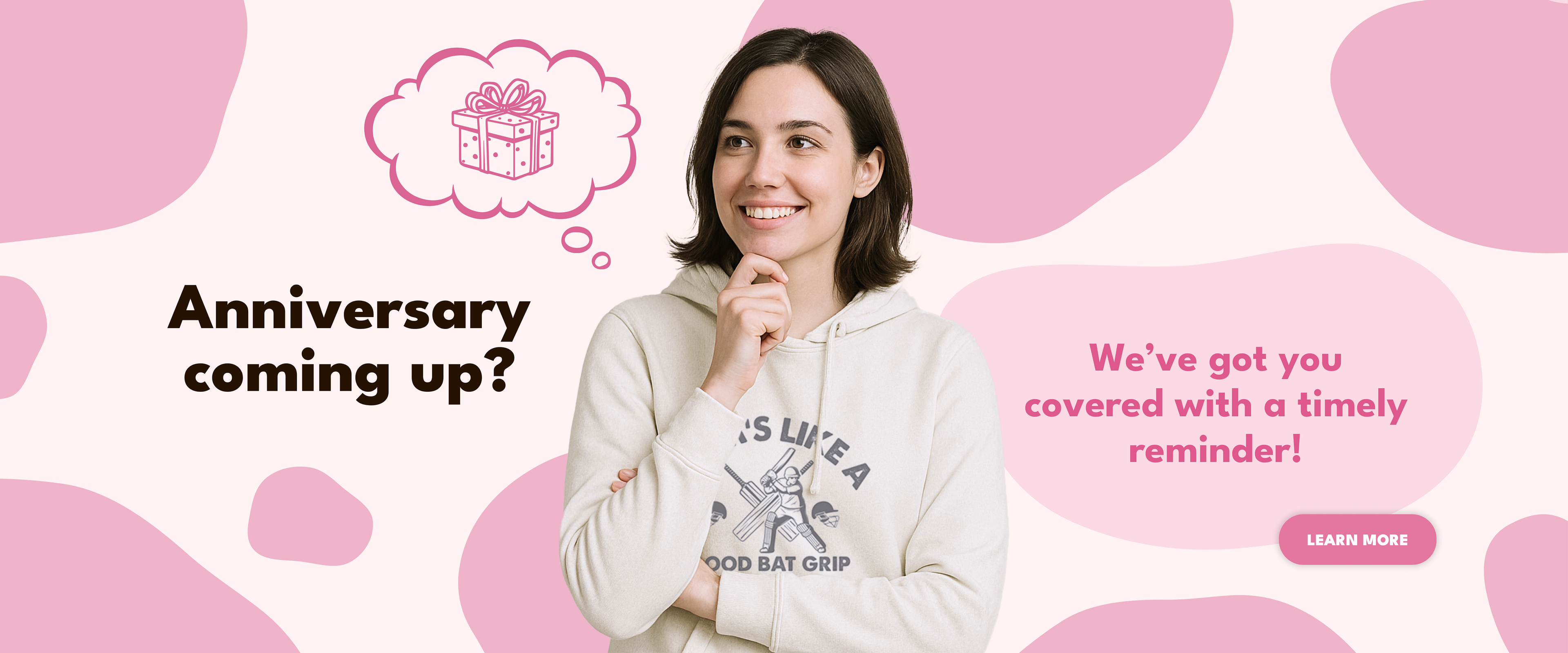 Woman in a white sweatshirt with text and graphics about an upcoming anniversary on a pink and white background.