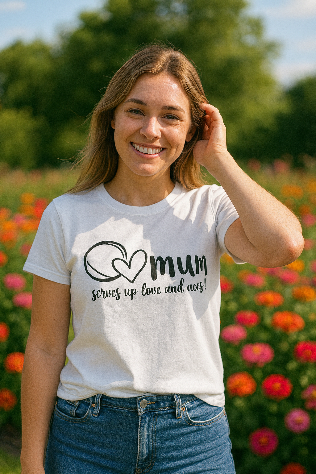 Woman wearing a white t-shirt with 'mum serves up love and aces' design in a garden setting