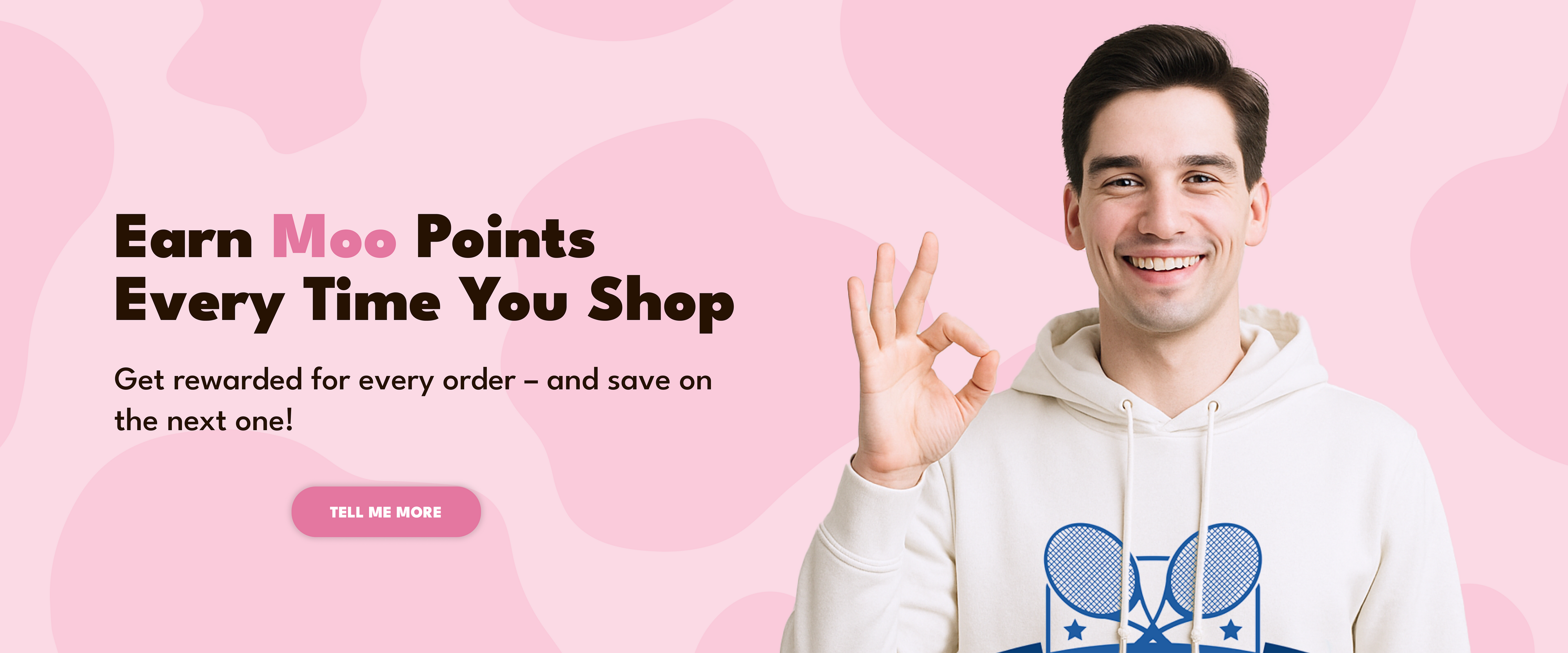 Man in a white hoodie with a blue logo on a pink background, promoting earning Moo Points.