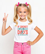 A little girl wearing a white t-shirt with If Cricket Is Life, Then Dad's The Groundskeeper on the front. A Funny Cricket T-Shirt, Premium Fabric, Multiple Junior Sizes