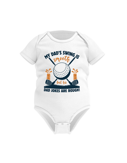 White baby onesie with golf-themed design and text on a white background with a Cows Corner slogan saying My dad's swing is smooth, but his jokes are rough.