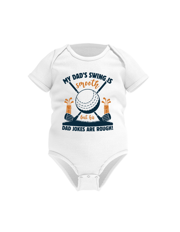 White baby onesie with golf-themed design and text on a white background with a Cows Corner slogan saying My dad's swing is smooth, but his jokes are rough.