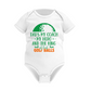 White baby onesie with text and a golf ball graphic on a white background with a Cows Corner slogan, Best dad by par.