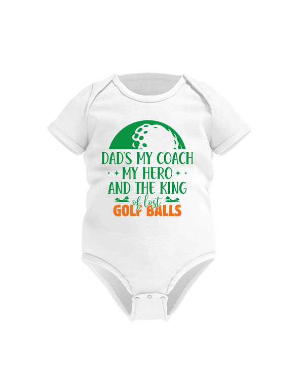 White baby onesie with text and a golf ball graphic on a white background with a Cows Corner slogan, Best dad by par.