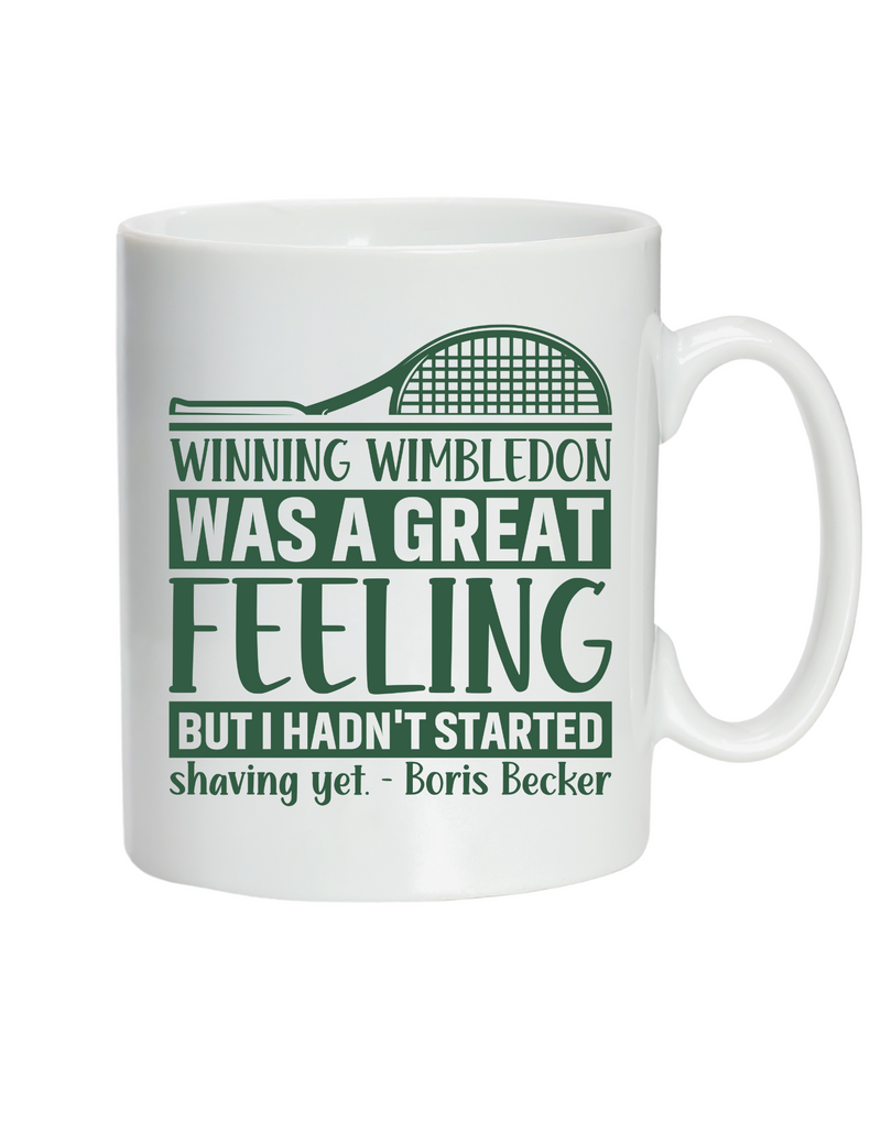 A white coffee cup with a tennis slogan on the front saying 'Winning Wimbledon Was a Great Feeling, but I Hadn’t Started Shaving Yet – Boris Becker'