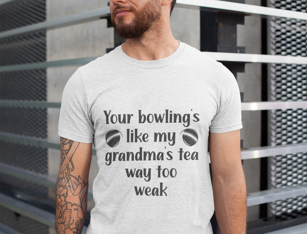 A man wearing a white t-shirt with Your bowling is like my grandma's tea, way too weak on the front! A Funny Cricket T-Shirt, Premium Fabric, Multiple Adult Sizes