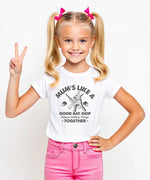 A little girl wearing a white t-shirt with Mums Like A Good Bat Grip, Always Holding Things Together on the front. A Funny Cricket T-Shirt, Premium Fabric, Multiple Junior Sizes, Perfect for Boys and Girls