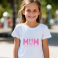 A girl wearing a white t-shirt with the lovely tennis saying on the front that reads 'Tennis with Mums. Best. Day. Ever!'