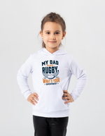 Child wearing a white hoodie with rugby-themed text on a light gray background, with a slogan on the front saying 'My Dad Plays Rugby. What’s Your Superpower?