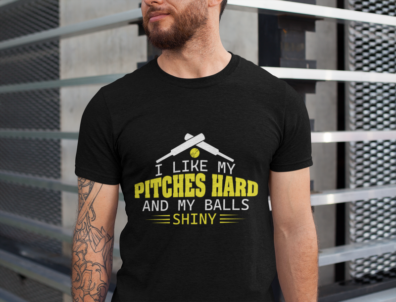 A man wearing a black t-shirt with I Like My Pitches Hard And My Balls Shiny on the front! A Funny Cricket Tee, Premium Fabric, Multiple Adult Sizes