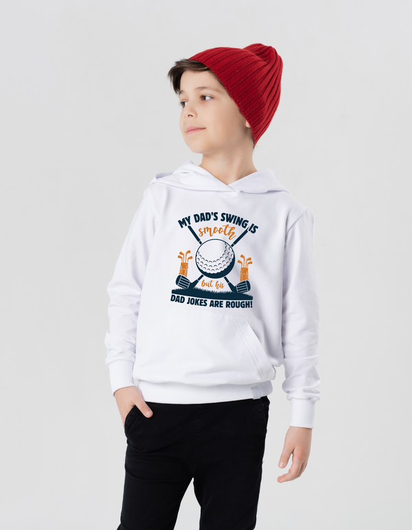 Child wearing a white hoodie with a graphic design on a plain background with a Cows Corner slogan saying My dad's swing is smooth, but his jokes are rough.