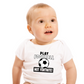 A baby wearing a white baby grow with the funny football slogan written on the front that reads 'Play Football Not Fortnite!