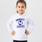A girl wearing a white hoodie with a funny football slogan on the front that reads 'Dribble You Can Barely Walk Straight!'
