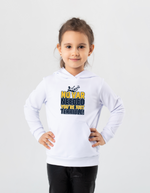 A little girl wearing a white t-shirt with the funny football slogan on the front that reads 'No VAR Needed You’re Just Terrible'