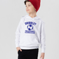 A boy wearing a white hoodie with a funny football slogan on the front that reads 'Dribble You Can Barely Walk Straight!'