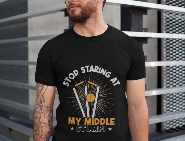 A man wearing a black t-shirt with Stop Staring At My Middle Stump on the front. A Funny Cricket T-Shirt, Premium Fabric, Multiple Adult Sizes