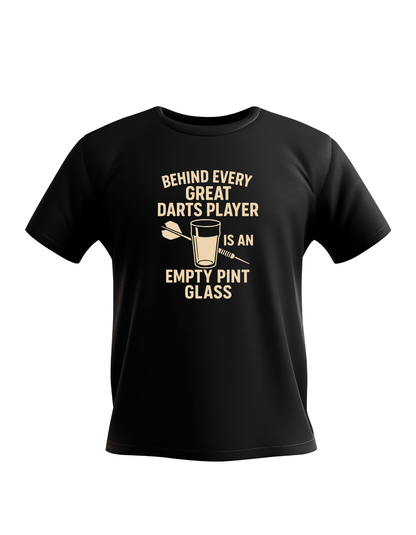 Black t-shirt with humorous darts player graphic and text on a white background with a Cows Corner slogan saying Behind every great darts player is an empty pint glass