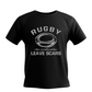 Black t-shirt with white rugby graphic and text on a white background with a Cows Corner slogan saying Rugby where friendly matches leave scars.