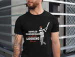 A man wearing a black t-shirt with Bowled & Bamboozled and Still Looking Better Than You on the front. A Funny Cricket T-Shirt, Premium Fabric, Multiple adult Sizes