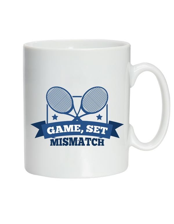 A white ceramic mug with the funny tennis slogan on the front that reads 'Game, Set, Mismatch'