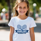 A girl wearing a white t-shirt with the funny tennis slogan on the front that reads 'Game, Set, Mismatch'