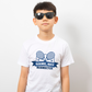 A boy wearing a white t-shirt with the funny tennis slogan on the front that reads 'Game, Set, Mismatch'