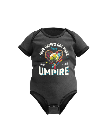 A black baby grow with a funny tennis slogan on the front that reads 'Your Game's Got More Faults Than A Bad Umpire'