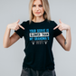 A lady wearing a black t-shirt with the funny tennis slogan on the front which reads 'Your Serve Is Slower Than My Grandma's Wifi'