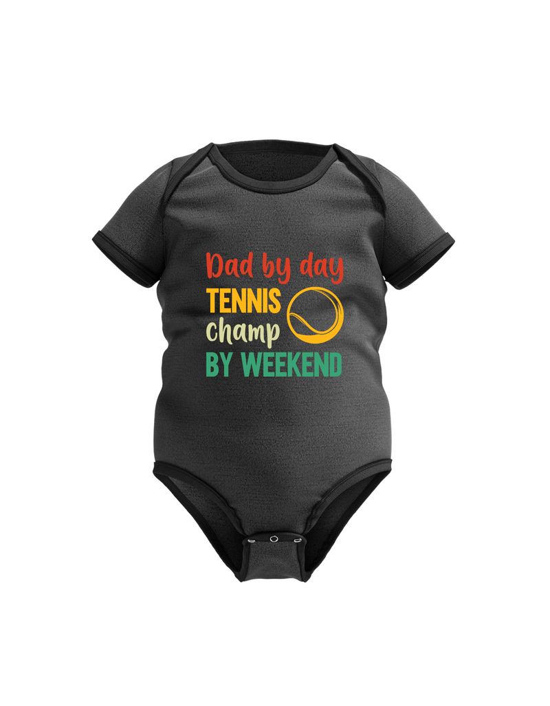 A black baby grow with a funny tennis slogan on the front that reads 'Dad By Day, Tennis Champ By Weekend'
