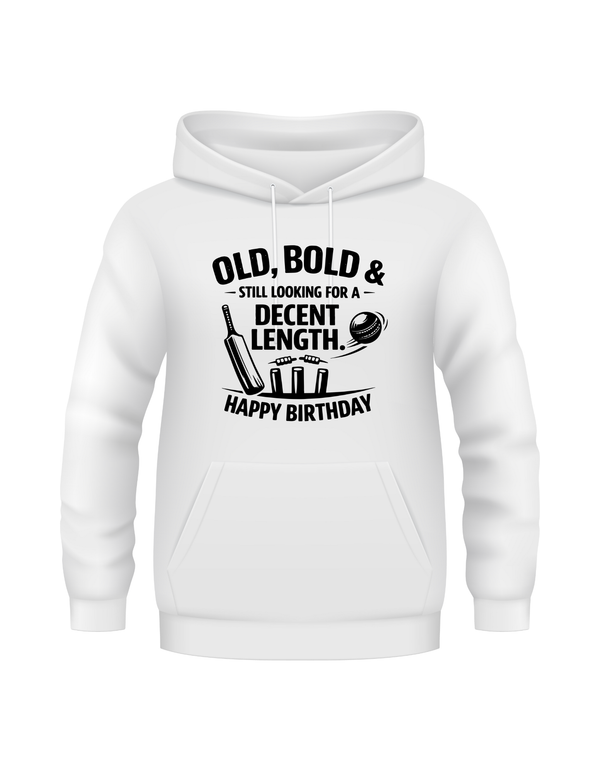 White hoodie with black text and graphics on a white background.  This is a Cows Corner hoodie with the funny cricket birthday slogan 'Old, Bold & Still Looking for a Decent Length. Happy Birthday'. Cows Corner gifts are perfect for sport-mad fans, these gifts work brilliantly for birthdays, new baby celebrations, Father’s Day, Mother’s Day, Christmas, anniversaries, thank you gifts, end-of-season team awards, graduations, retirements, and just-because moments when you want to raise a smile. 
