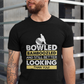 A man wearing a black t-shirt with Bowled & Bamboozled and Still Looking Better Than You on the front. A Funny Cricket T-Shirt, Premium Fabric, Multiple Adult Sizes