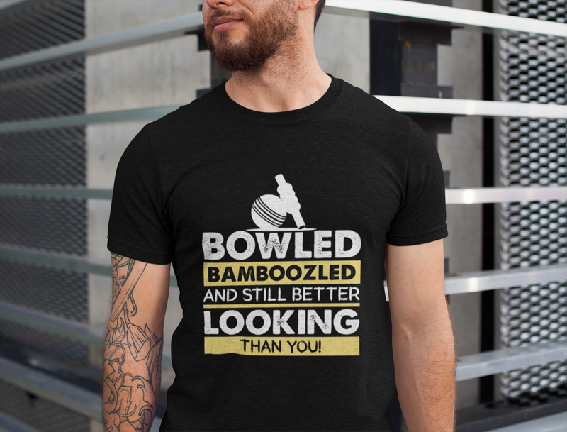 A man wearing a black t-shirt with Bowled & Bamboozled and Still Looking Better Than You on the front. A Funny Cricket T-Shirt, Premium Fabric, Multiple Adult Sizes