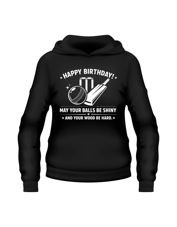 Black hoodie with white text and graphics on a white background. A Cows Corner hoodie with the funny cricket birthday slogan 'Happy Birthday! May Your Balls Be Shiny and Your Wood Be Hard.' Cows Corner gifts are perfect for sport-mad fans, these gifts work brilliantly for birthdays, new baby celebrations, Father’s Day, Mother’s Day, Christmas, anniversaries, thank you gifts, end-of-season team awards, graduations, retirements, and just-because moments when you want to raise a smile. 
