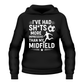 Black hoodie with white text and graphics on a white background saying 'I've had sh*ts more impressive than my midfield' a Cows Corner funny slogan hoodie