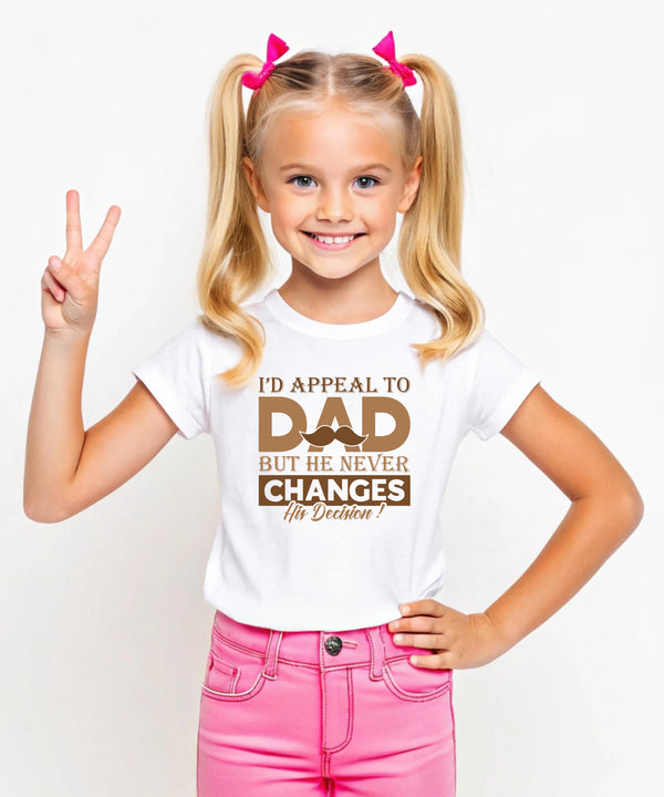 A little girl wearing a white t-shirt with Funny Kids Cricket T-shirt – "I'd Appeal To Dad, But He Never Changes His Decision on the front. A Funny Cricket T-shirt, Premium Fabric, Multiple Junior Sizes, Perfect for Boys and Girls