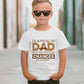 A little boy wearing a white t-shirt with Funny Kids Cricket T-shirt – "I'd Appeal To Dad, But He Never Changes His Decision on the front. A Funny Cricket T-shirt, Premium Fabric, Multiple Junior Sizes, Perfect for Boys and Girls