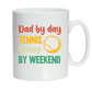 A white ceramic mug with a funny tennis slogan that reads 'Dad By Day, Tennis Champ By Weekend'