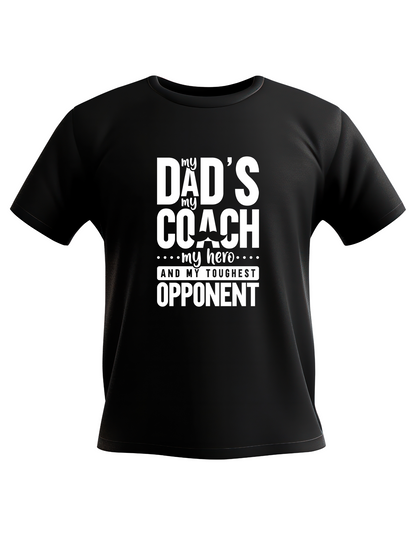 A black t-shirt with the funny tennis slogan on the front that reads 'My Dads My Coach, My Hero And My Toughest Opponent'