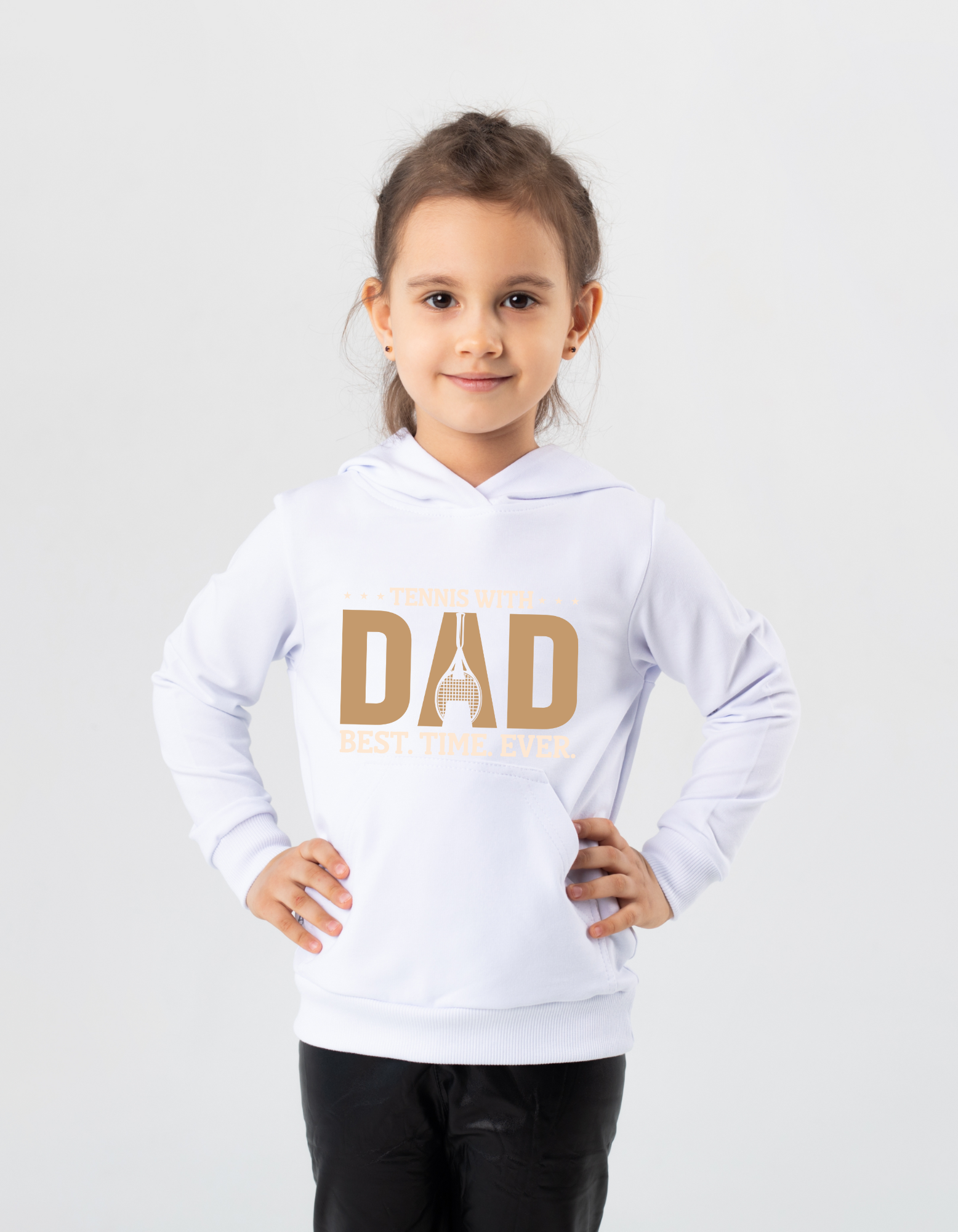 A girl wearing a white hoodie with the funny tennis slogan on the front that reads 'Tennis with Dad, BEST. TIME. EVER'