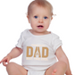 A baby wearing a white baby grow with the funny tennis slogan on the front that reads 'Tennis with Dad, BEST. TIME. EVER'