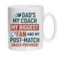 White mug with colorful text about a father's role in sports on a white background, with a slogan on the front saying 'Dad’s My Coach My Biggest Fan and My Post-Match Snack Provider!