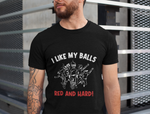 A man wearing a black t-shirt with I Like My Balls Red And Hard on the front. A Funny Cricket T-Shirt, Premium Fabric, Multiple Adult Sizes