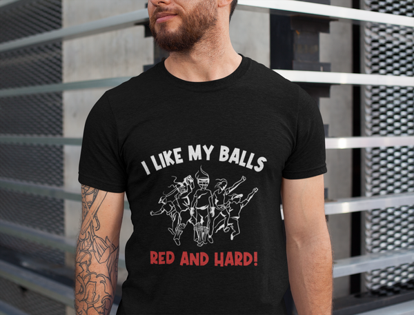 A man wearing a black t-shirt with I Like My Balls Red And Hard on the front. A Funny Cricket T-Shirt, Premium Fabric, Multiple Adult Sizes