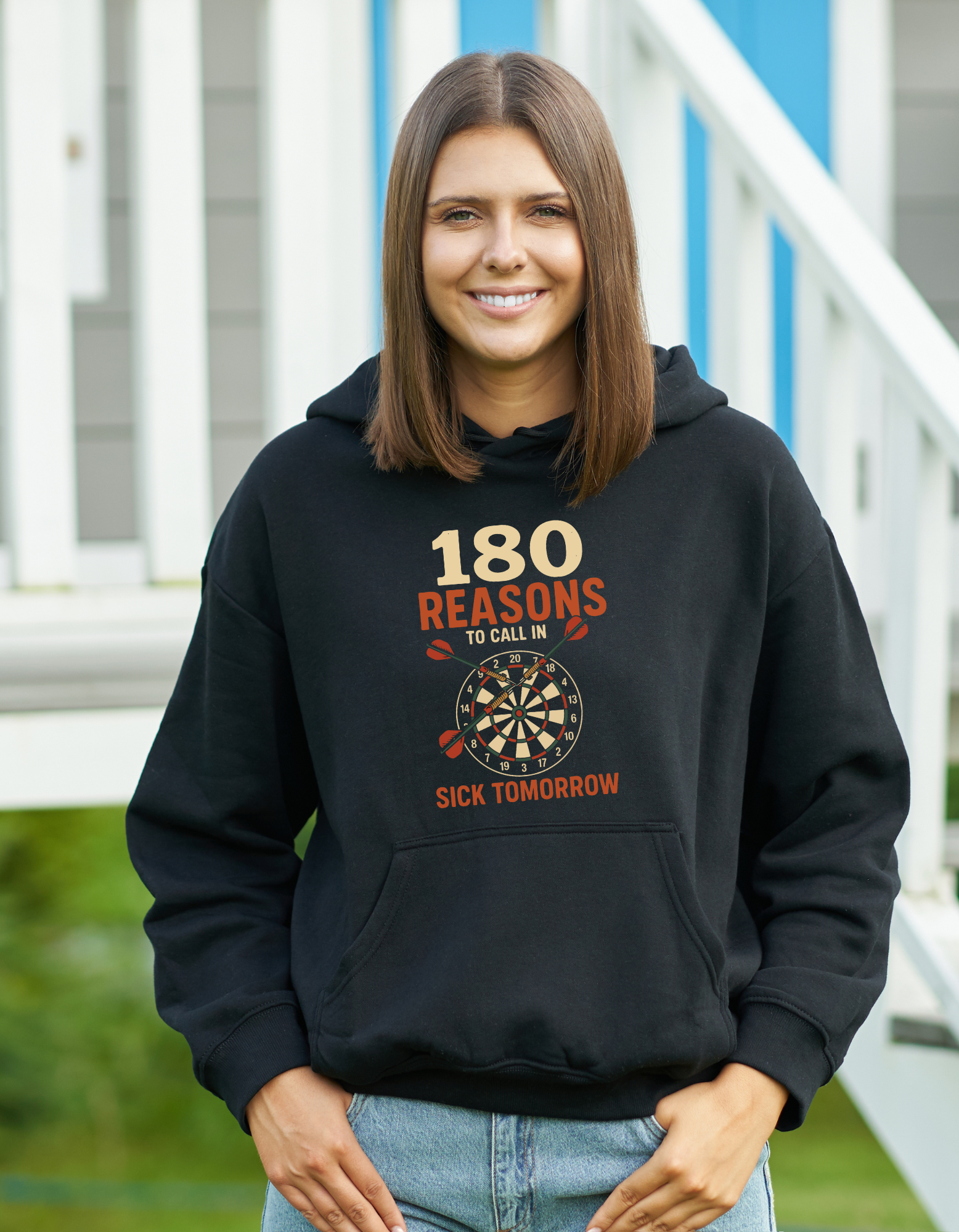 A lady wearing a black hoodie with cows corner slogan on the front saying 180 Reasons To Call In Sick Tomorrow 