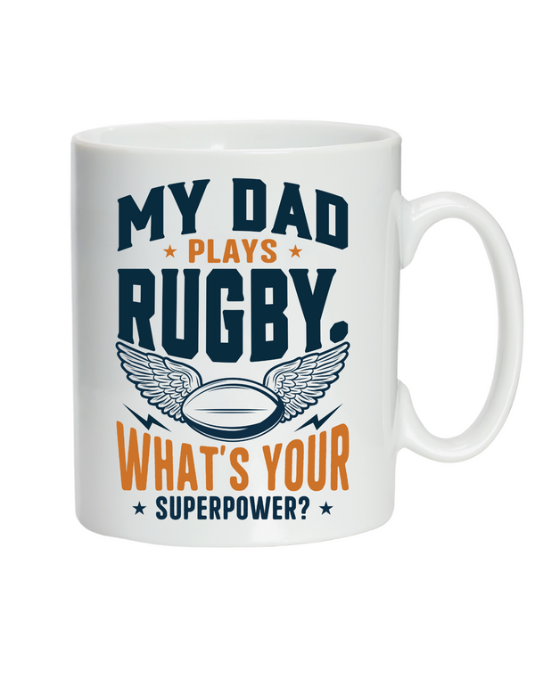 White mug with rugby-themed text and design on a white background, with a slogan on the front saying 'My Dad Plays Rugby. What’s Your Superpower?